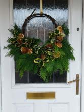 Picture of a Christmas Wreath hanging on a front door